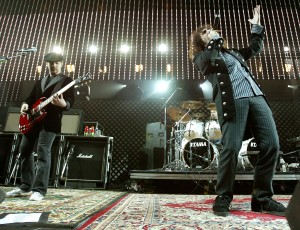 LOS ANGELES - DECEMBER 10:  Guitarist Daron Malakian, drummer John Dolmavan, and lead singer Serj Tankian of System Of A Down performs at 106.7 KROQ's "Almost Acoustic Christmas" at Gibson Ampitheater at Universal Studios on December 10, 2005 in Los Angeles, California.  (Photo by Karl Walter/Getty Images)