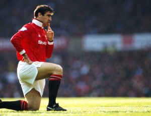 MANCHESTER, UNITED KINGDOM - APRIL 23: Manchester United striker Eric Cantona reacts during an FA Premier League match between Manchester United and Manchester City at Old Trafford on April 23, 1993 in Manchester, England, United won the game 2-0 with both goals scored by Cantona.  (Photo by Anton Want/Allsport/Getty Images)